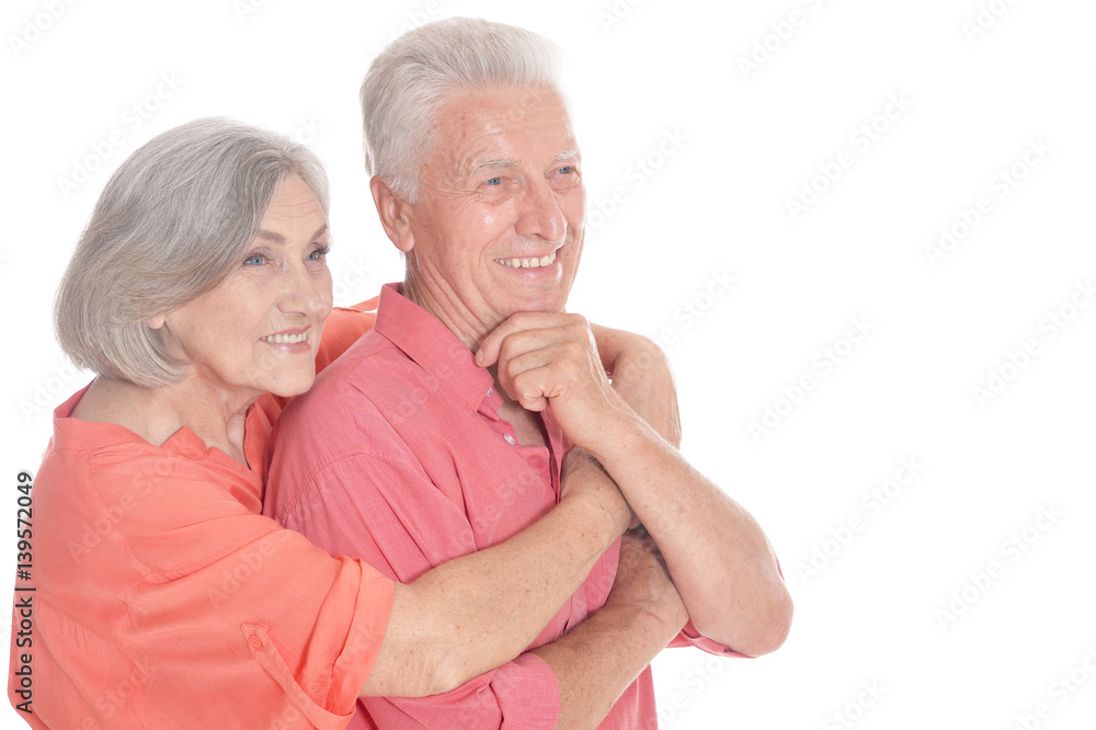 Happy old couple embracing on a white background Happy old couple embracing on a white background