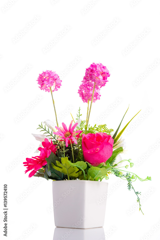 Artificial flower bouquet in ceramic pot over white
