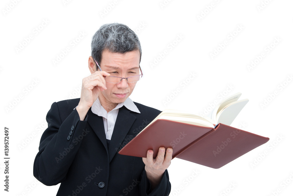 Old asian woman reading book having problem with her eyes Old asian woman reading book having problem with her eyes