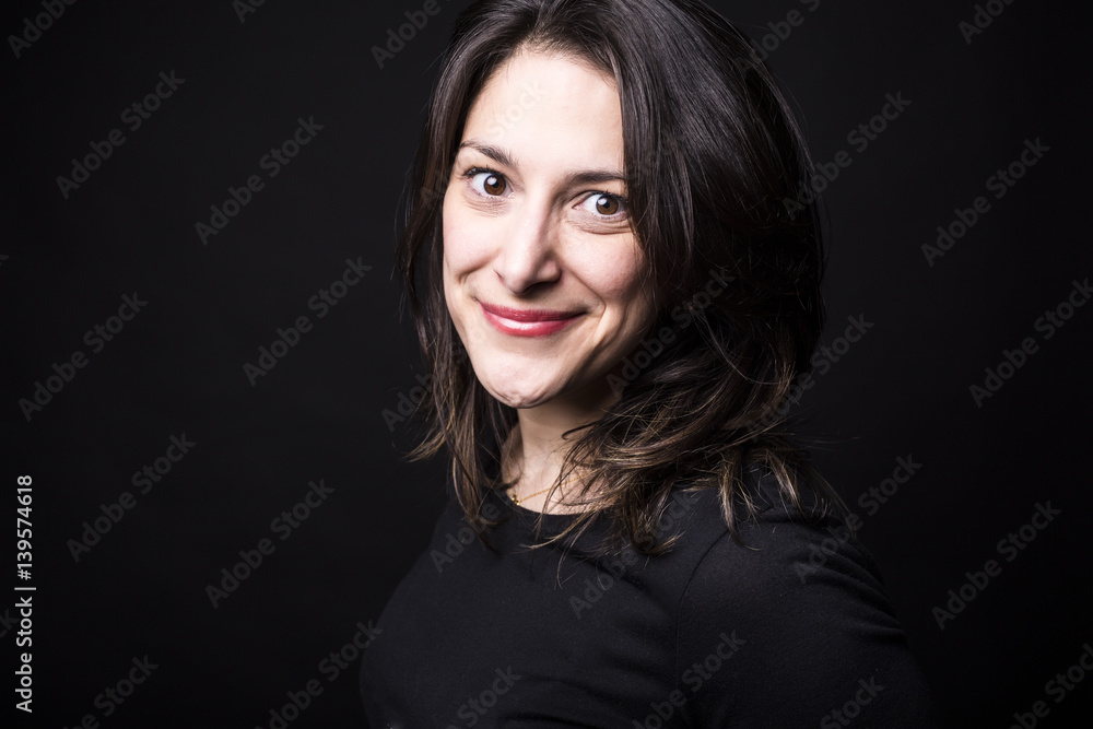 young caucasian woman portrait on black background