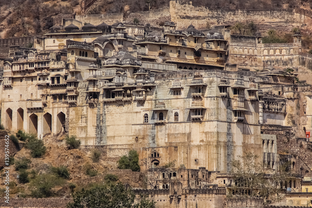View of impressive Garh Palace nestled in the mountains, , Bundi, Rajasthan, India