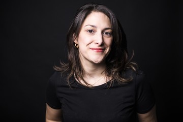 young caucasian woman portrait on black background