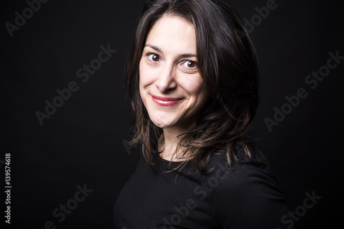 young caucasian woman portrait on black background