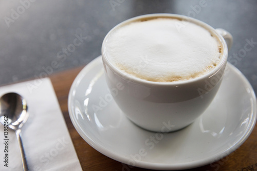 cup of cappucino coffee on the table