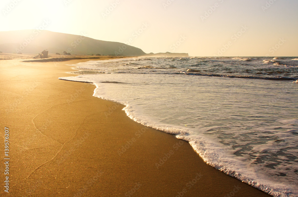 Pure sandy beach seashore in morning sunshine Pure sandy beach seashore in morning sunshine