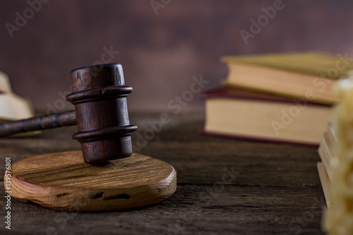 Law theme, mallet of judge, wooden gavel, books