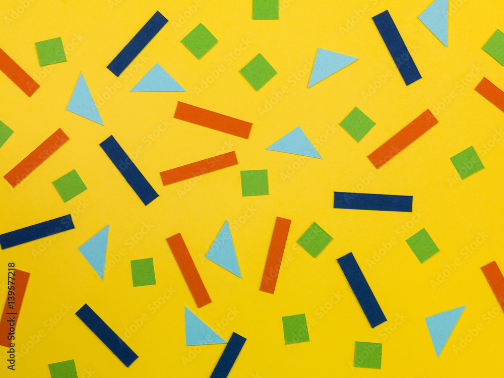 Random Pattern of Geometric Shapes on a Yellow Background Random Pattern of Geometric Shapes on a Yellow Background