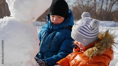 children making a snowman in the Playground