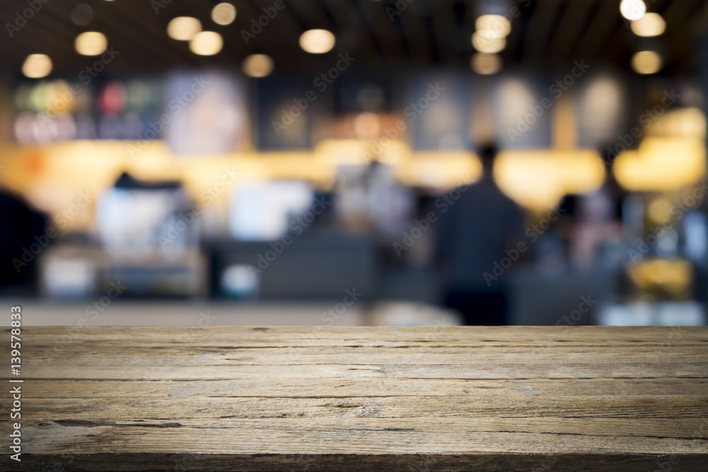 Empty wooden table for present product on coffee shop