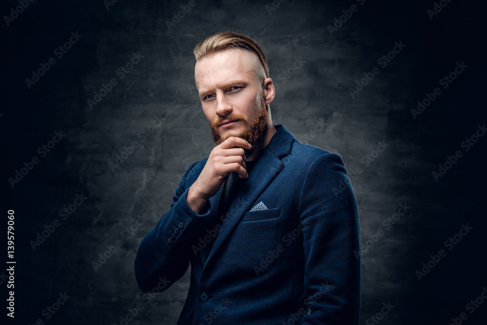 Fototapeta premium Redhead hipster male dressed in a blue jacket.