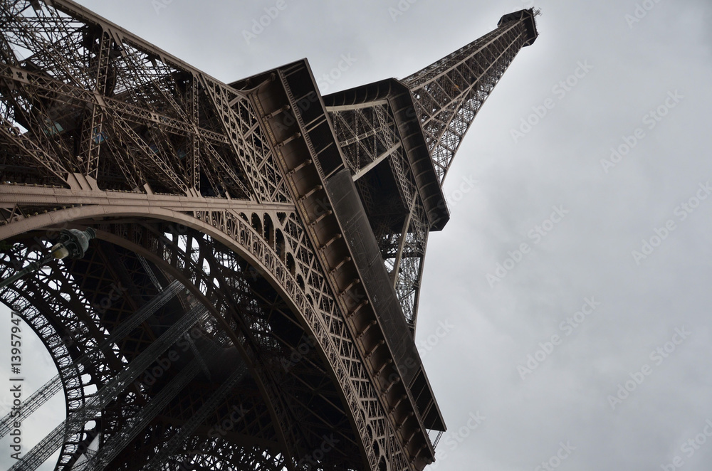 The Eiffel Tower shot from below, with its imposing iron structure