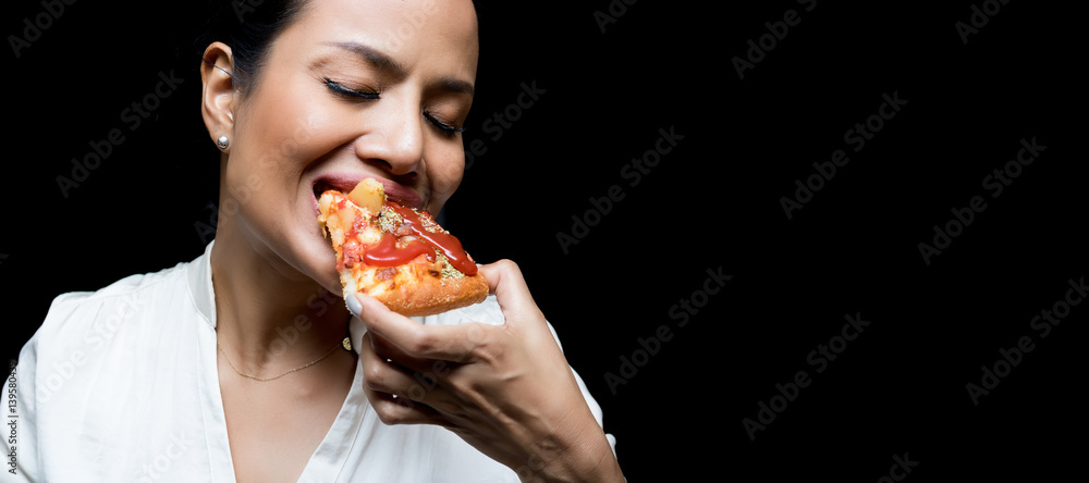 woman eating pizza