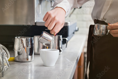 barista is preparing coffee on coffee machine