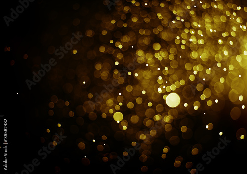 Bokeh light gold color black background