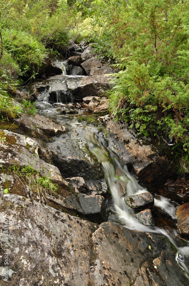 Fototapeta premium Waterfall in Rollonhytte Vardane, Norway 2013