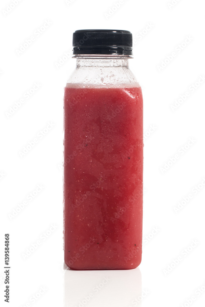 Fresh vegetable detox juice on plastic bottle over a white background Fresh vegetable detox juice on plastic bottle over a white background