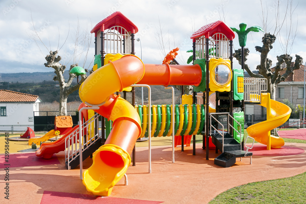 park playground  for kids with slides and cottages