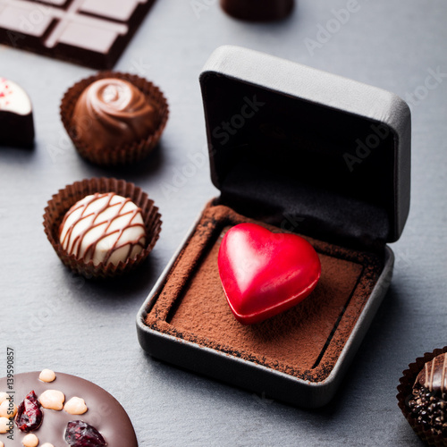 Heart shaped chocolate candy in a gift box.