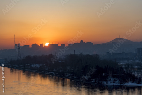 An amazing sunset over Yenisei river and Krasnoyarsk city in Siberia