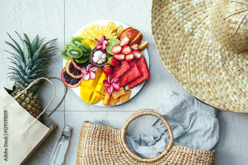 Fruit plate and summer fashion accessories top view
