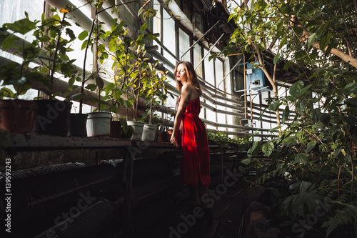 Side view of young woman in greenhouse © Drobot Dean