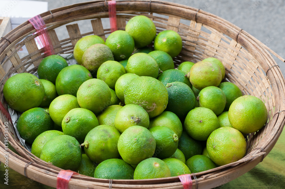 fresh green lime in basket at market thailand asia fresh green lime in basket at market thailand asia