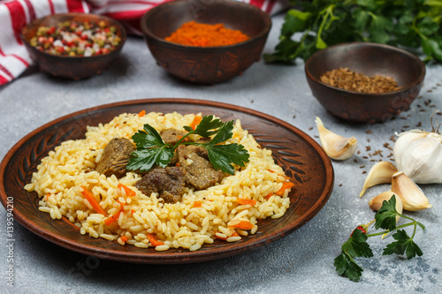 Pilaf with meat and vegetables with seasonings and spices. A popular dish of Asian cuisine