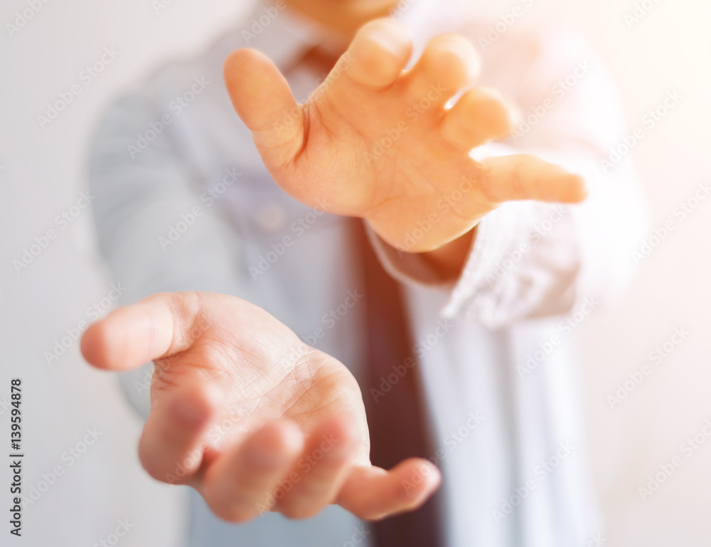 Businessman showing his empty hand Businessman showing his empty hand