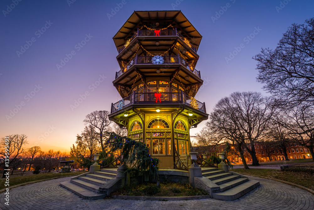 Fototapeta premium Christmas decorations on the Patterson Park Pagoda at sunset, in Baltimore, Maryland.