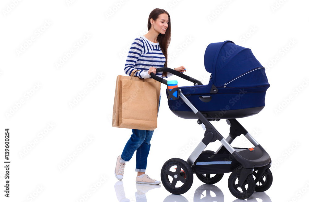 Full length portrait of a mother with a stroller, isolated on white background Full length portrait of a mother with a stroller, isolated on white background