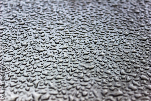 Water drops on painted metal surfaces