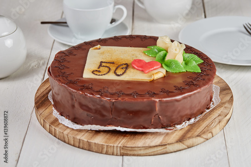 Delicious chocolate cake with marzipan rose
