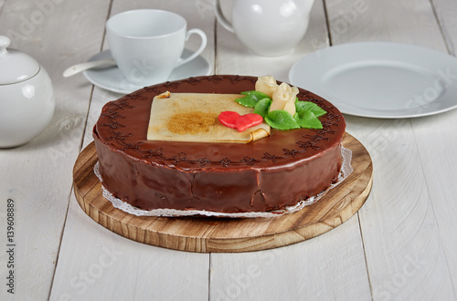 Delicious chocolate cake with marzipan rose