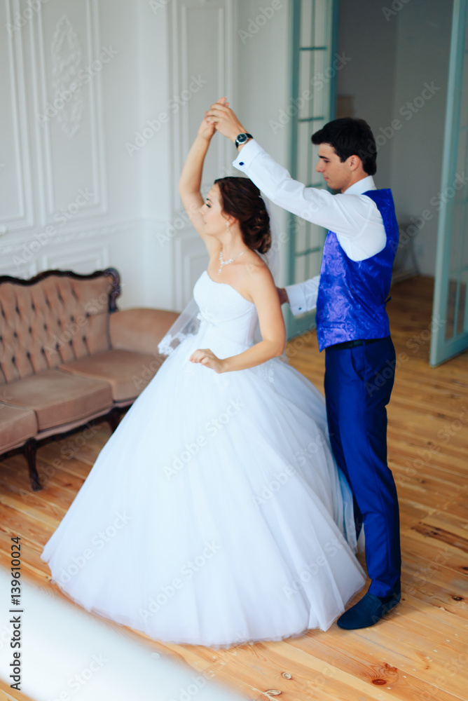 bride dancing with the groom in the room bride dancing with the groom in the room