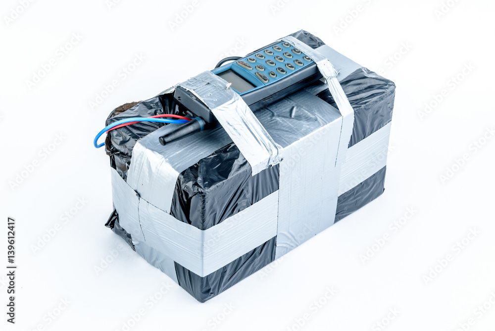adio-controlled bomb with lcd screen, cell phone and colored wires on a white background. Concept image of terrorism, Explosion adio-controlled bomb with lcd screen, cell phone and colored wires on a white background. Concept image of terrorism, Explosion