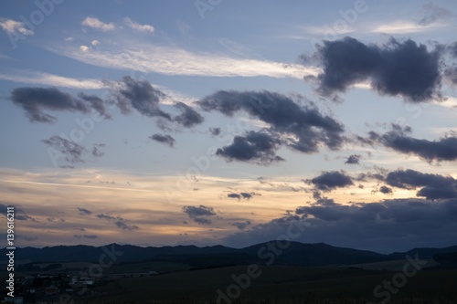 Sunset and sunrise with dramatic colorful clouds. Slovakia