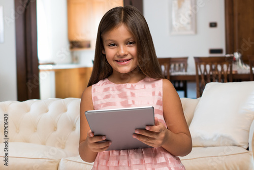Smiling child using a tablet