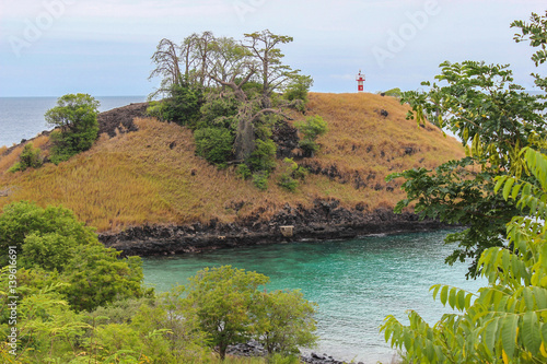 Lagoa Azul ( Blue Lake) a beautiful beach with baobab and a lighthouse up the cliff in Sao Tome and Principe - Africa photo