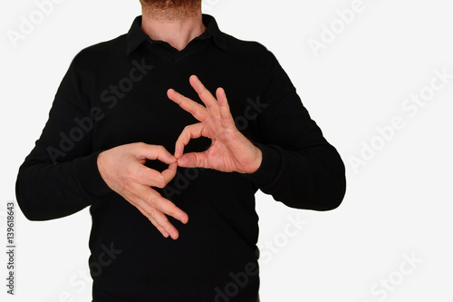 Fotografía Sign language interpreter man translating a meeting to ASL, American Sign Language