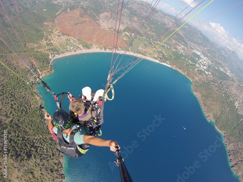 Fly in the sky above laguna Paragliding tandem