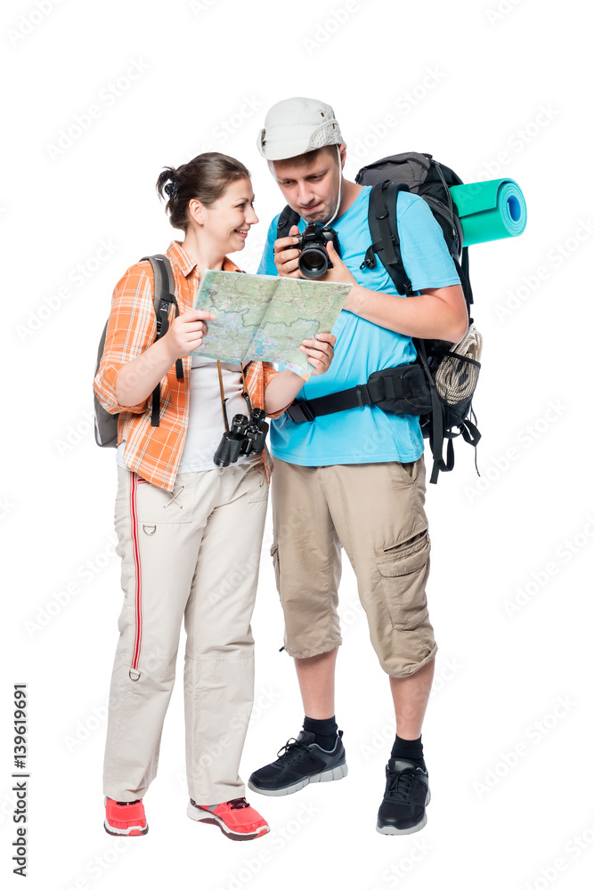 Portrait of happy travelers with a map and a camera on a white background Portrait of happy travelers with a map and a camera on a white background