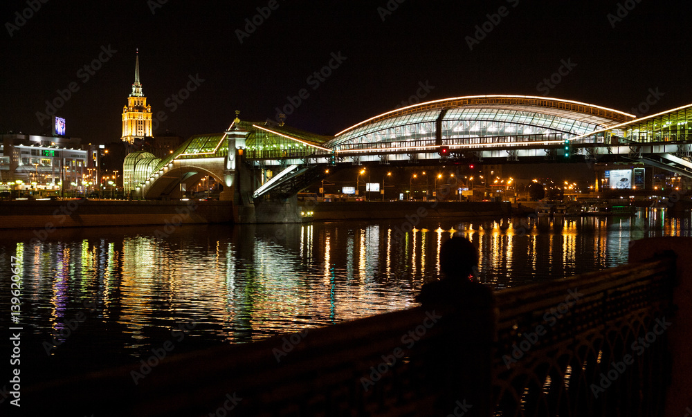Obraz premium The reflection of the bridge in the Moscow river, Russia.