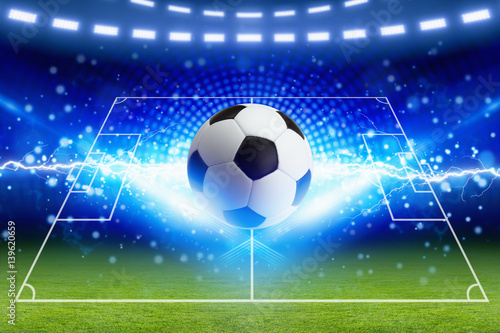 Soccer ball, bright blue lightning, green football field with layout