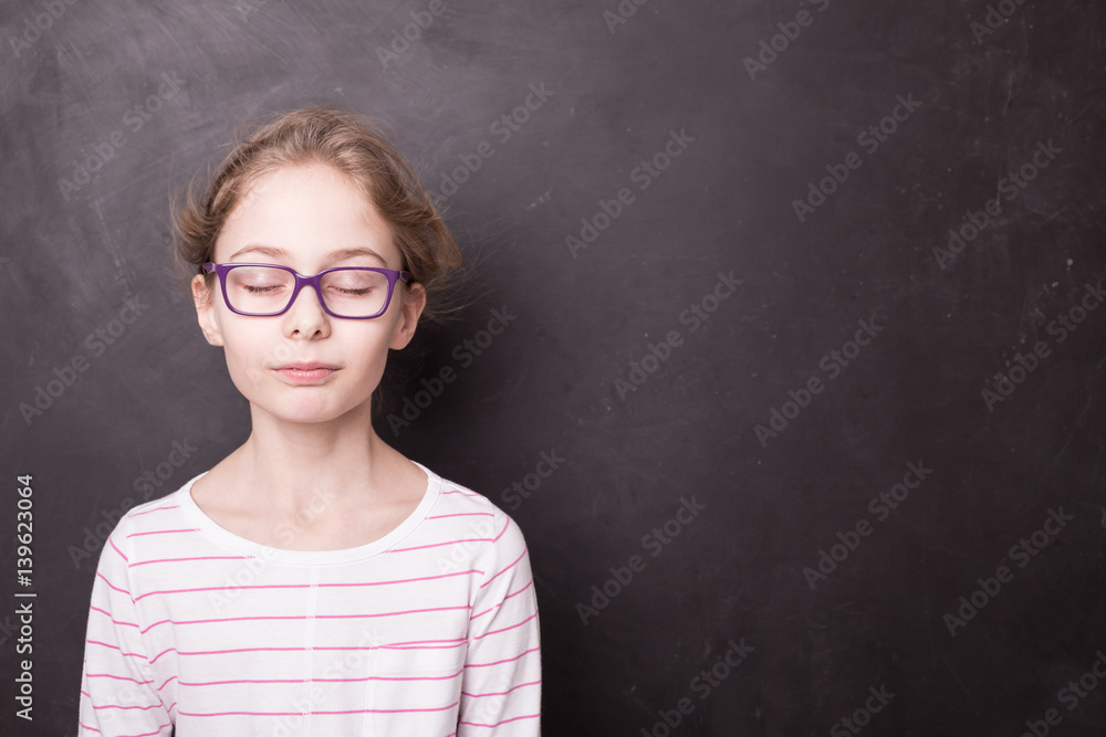 School - child girl with eyes closed at the blackboard School - child girl with eyes closed at the blackboard