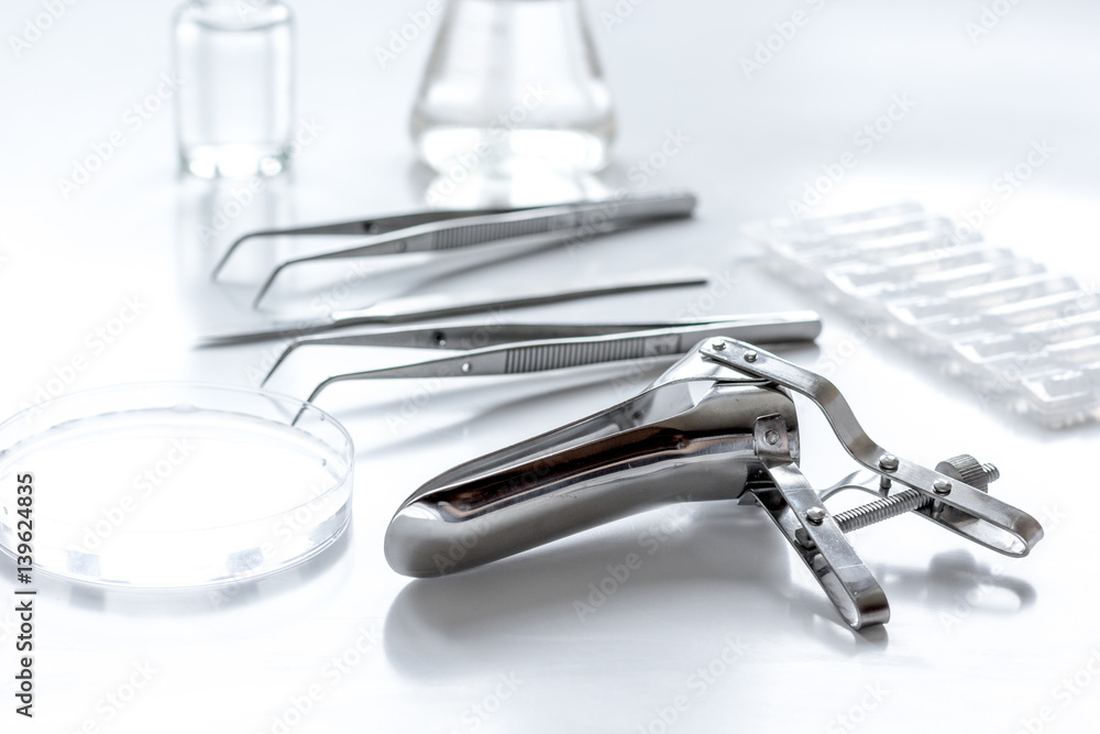 instruments of gynecologist on white background instruments of gynecologist on white background