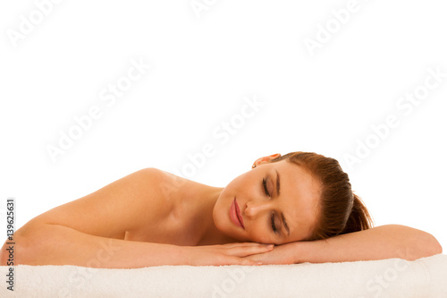 woman rests on white towel - conceptual photo for skin care and spa