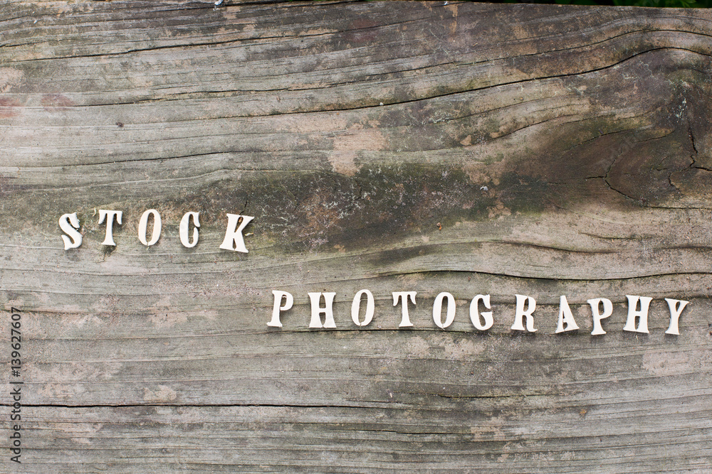 Fototapeta premium Stock photography words or character on wood background