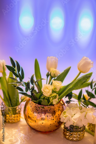 beautiful flowers in vases and decorations at the wedding