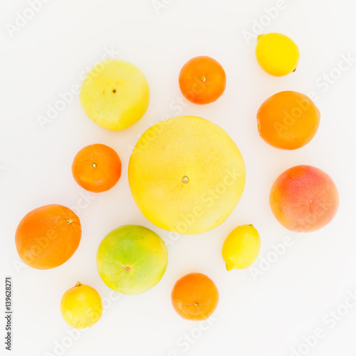 Fruits pattern of lemon, orange, grapefruit, sweetie and pomelo on white background. Flat lay, top view. Fruit's background