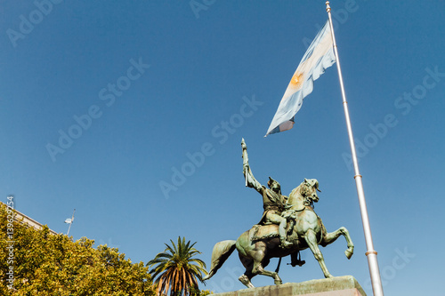 Statue of Manuel Belgrano and Argentine flag in the Plaza de Mayo of Buenos Aires photo